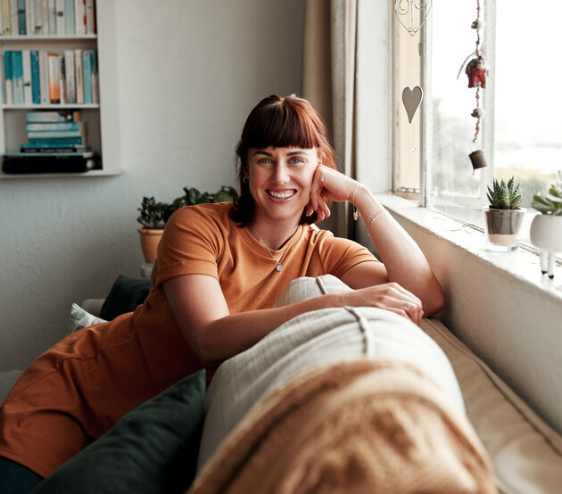 Woman smiling on a couch